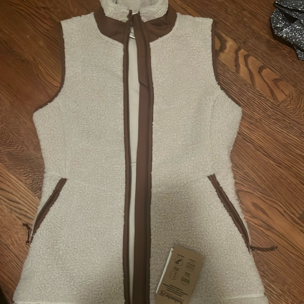 Size small fuzzy vest. New with tags